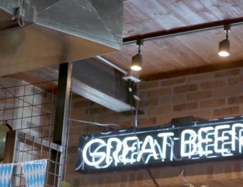 Great beer sign CTA A light up sigh that reads 'great beer' in a bar