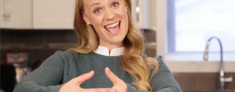 What's Dry9 Woman making hand gesture to symbol pregnancy